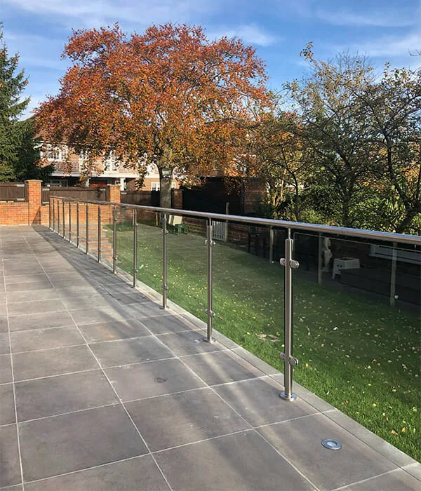 Stainless steel post glass balustrade on a garden terrace
